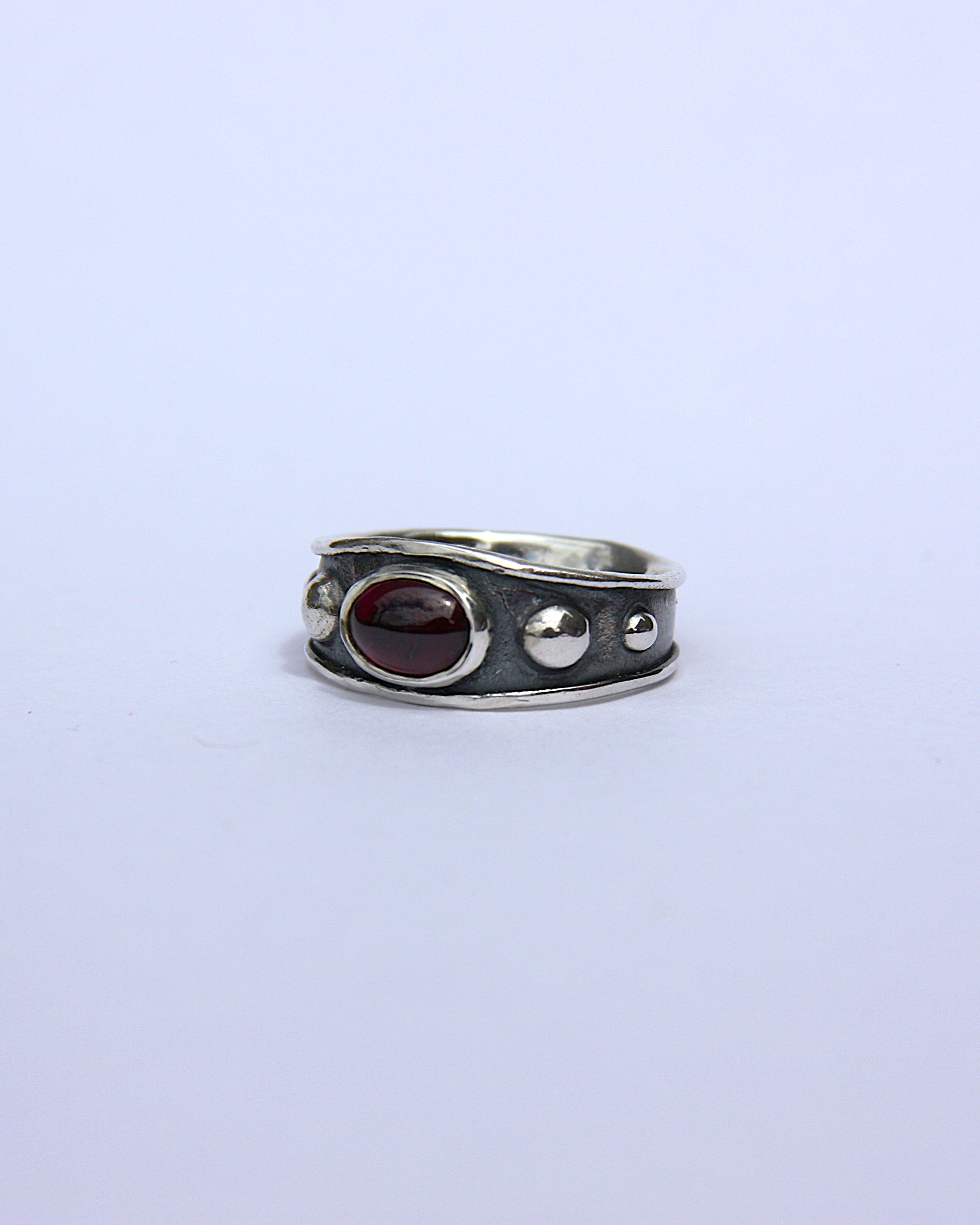 Reed Ring Garnet J 1/2